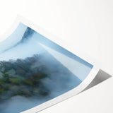 Rolled print showcasing a stunning landscape of a majestic castle surrounded by lush greenery, designed for home decor, and elegantly packaged in a protective tube.