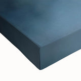 Close-up of a vibrant stretched canvas showcasing a picturesque landscape with a medieval castle, featuring rich colors and intricate details, perfect for home decor.