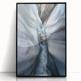 Framed acrylic wall art showcasing a vibrant landscape design of caves, featuring deep colors and intricate details, set against a sleek black frame. Ideal for modern home decor.