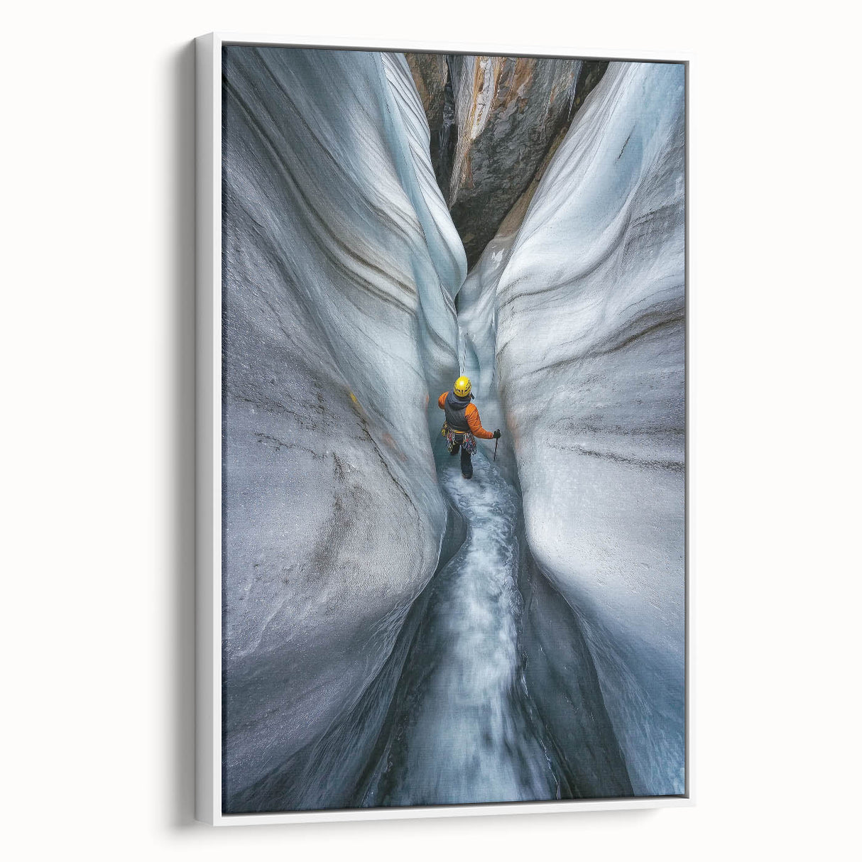 Framed canvas artwork of a serene cave landscape, showcasing intricate natural formations in earthy tones. The piece is elegantly displayed with a white frame, enhancing its aesthetic appeal and making it an ideal decor choice for nature enthusiasts.