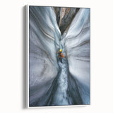 Framed canvas artwork of a serene cave landscape, showcasing intricate natural formations in earthy tones. The piece is elegantly displayed with a white frame, enhancing its aesthetic appeal and making it an ideal decor choice for nature enthusiasts.
