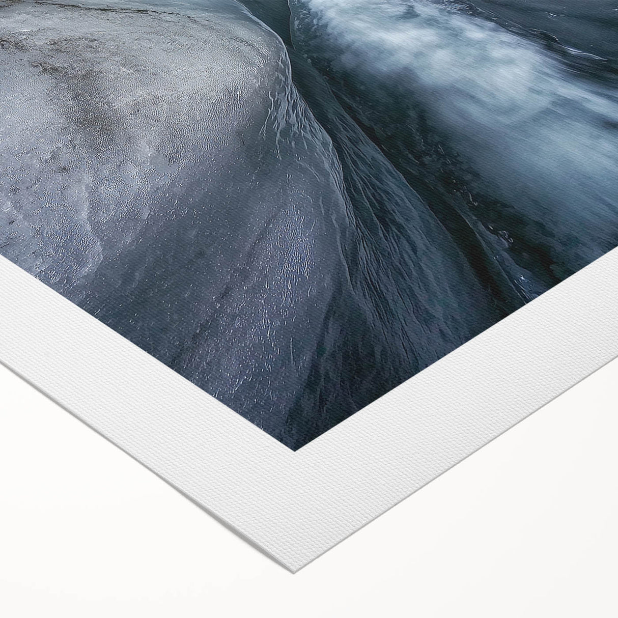 Vibrant rolled canvas artwork showcasing a stunning landscape with intricate cave formations and earthy tones, expertly wrapped for safe shipping in a durable tube.
