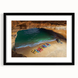 Black-framed landscape artwork featuring dramatic cliffs and vibrant colors, elegantly matted for a polished presentation, perfect for home decor.