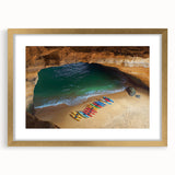 Elegant gold-framed landscape print featuring dramatic cliffs, with a white mat for added contrast, ideal for enhancing home décor in living spaces or offices.