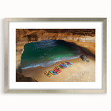 Silver-framed landscape artwork depicting dramatic cliffs, complete with a white mat border, ideal for modern home decor, emphasizing natural beauty and elegance.