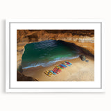 Framed landscape artwork depicting dramatic cliffs with a white mat border, showcasing natural scenery ideal for home decor or office settings.
