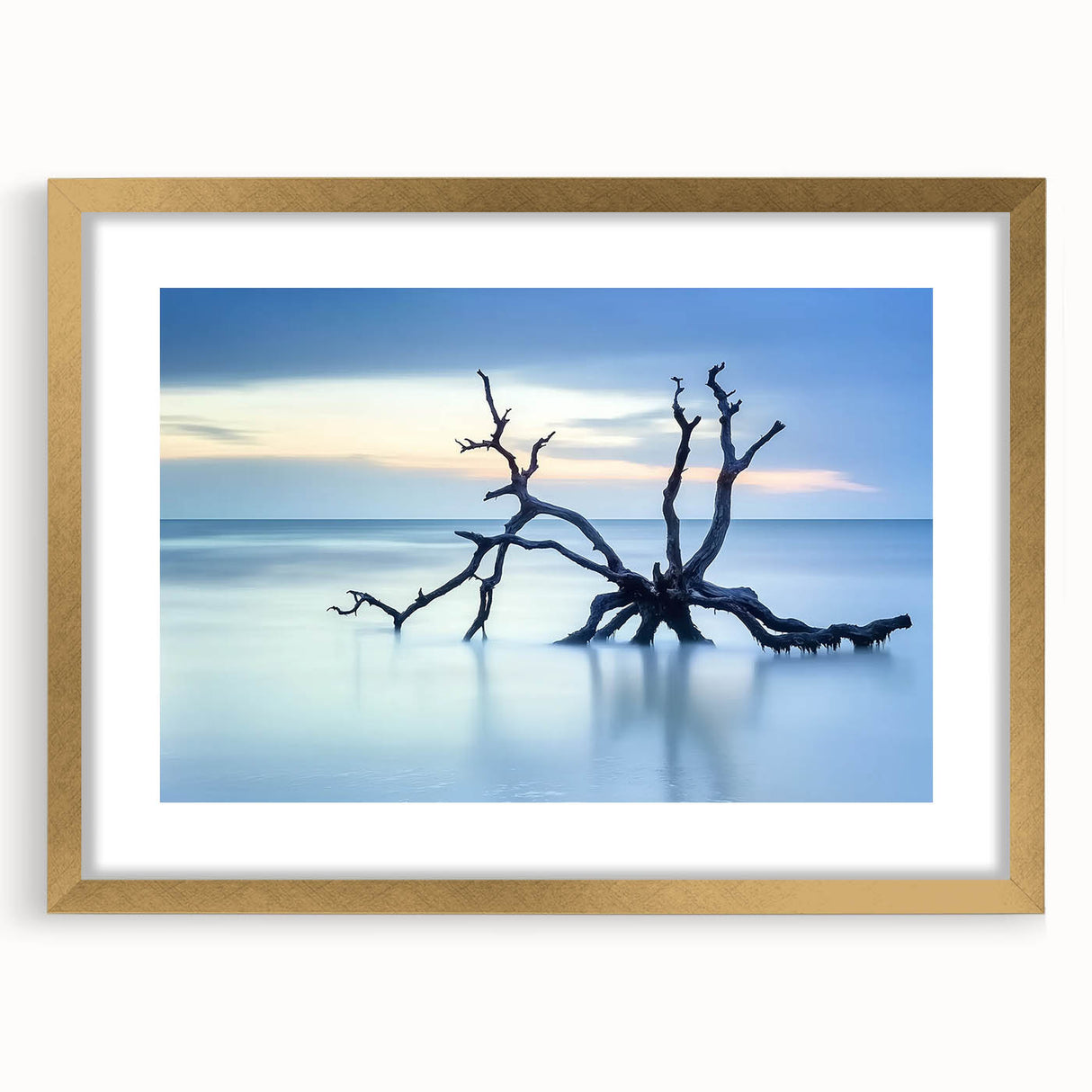 Framed landscape artwork depicting serene beaches with soft waves and golden matting, ideal for enhancing coastal-themed interior decor.