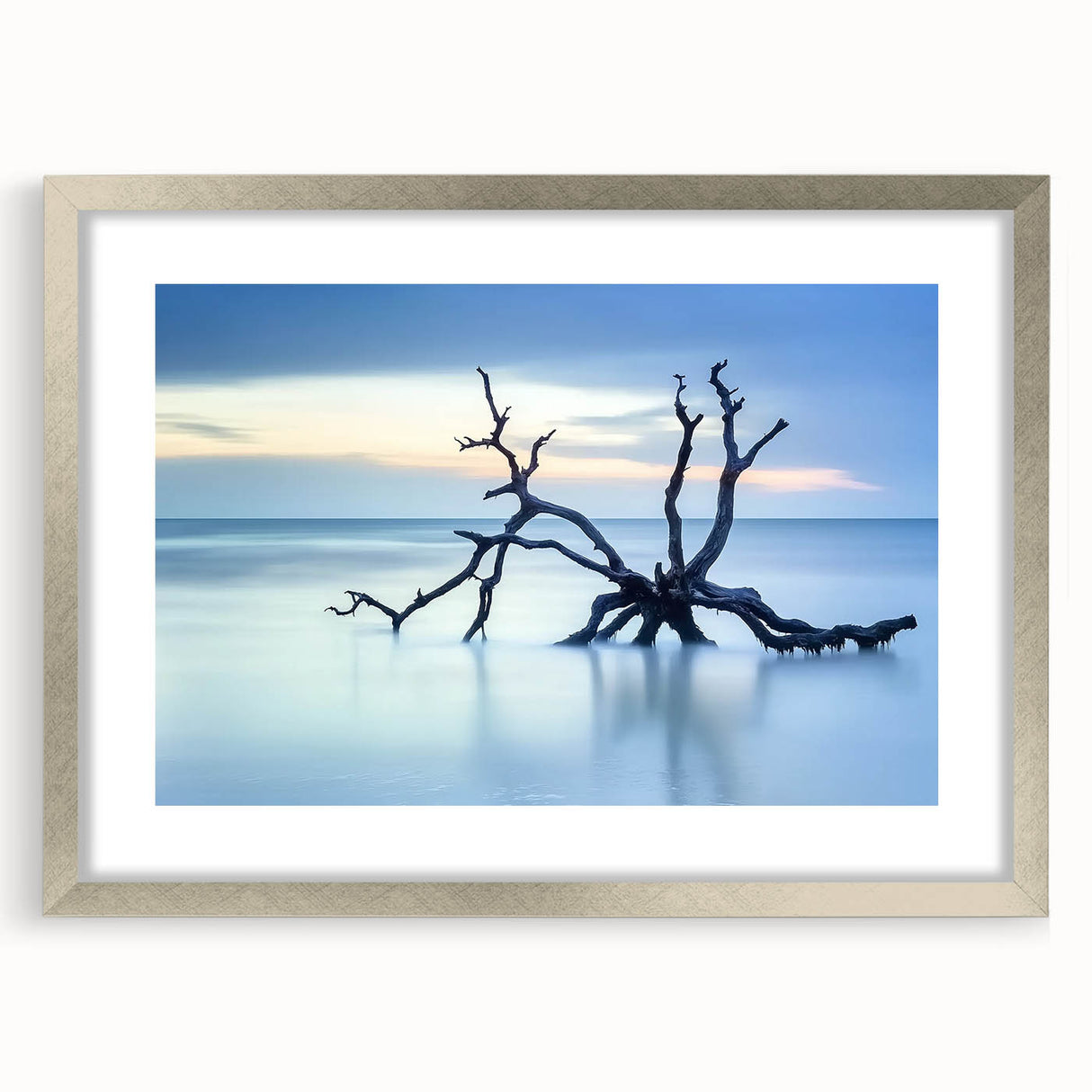 Framed landscape artwork depicting serene beaches, featuring a silver mat and elegant frame, ideal for enhancing modern home decor. Perfect for beach lovers.
