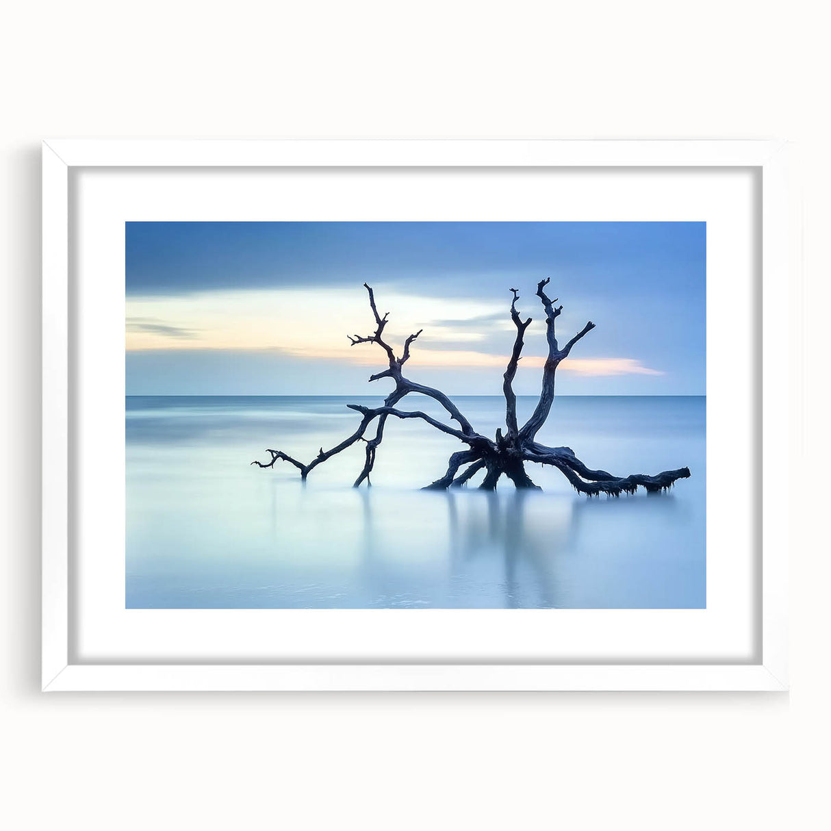 Landscape artwork featuring serene beach scene framed in white with a mat, showcasing soft pastel colors and calming waves, ideal for coastal decor.