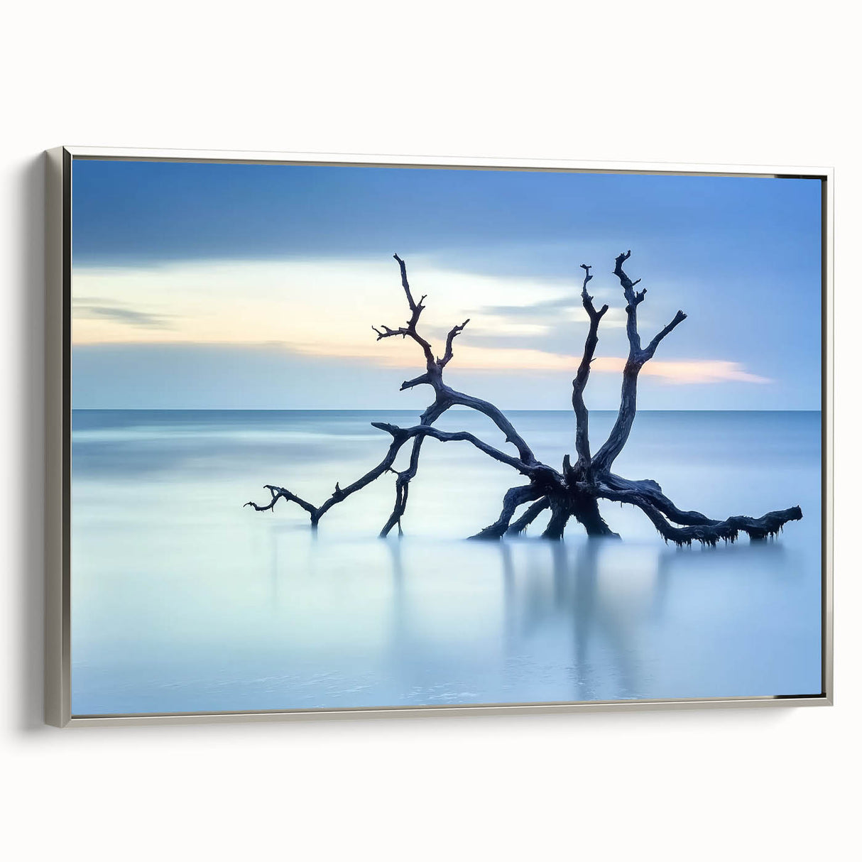 Framed canvas artwork depicting a serene beach landscape, showcasing vibrant colors and intricate details, accented with a sleek silver frame for modern decor.