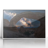 Framed acrylic artwork showcasing a stunning landscape of colorful canyons, featuring vibrant hues of red, orange, and blue, set against a sleek white frame, perfect for enhancing modern home decor.