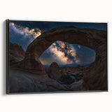 Framed landscape canvas art depicting a stunning view of canyons in rich earth tones, featuring a sleek black frame, perfect for modern home decor. Ideal for enhancing living spaces or office environments with natural beauty.