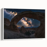 Framed canvas artwork showcasing a breathtaking landscape of canyons in vibrant hues, set against a white frame. Ideal for enhancing home decor with nature-inspired elegance.