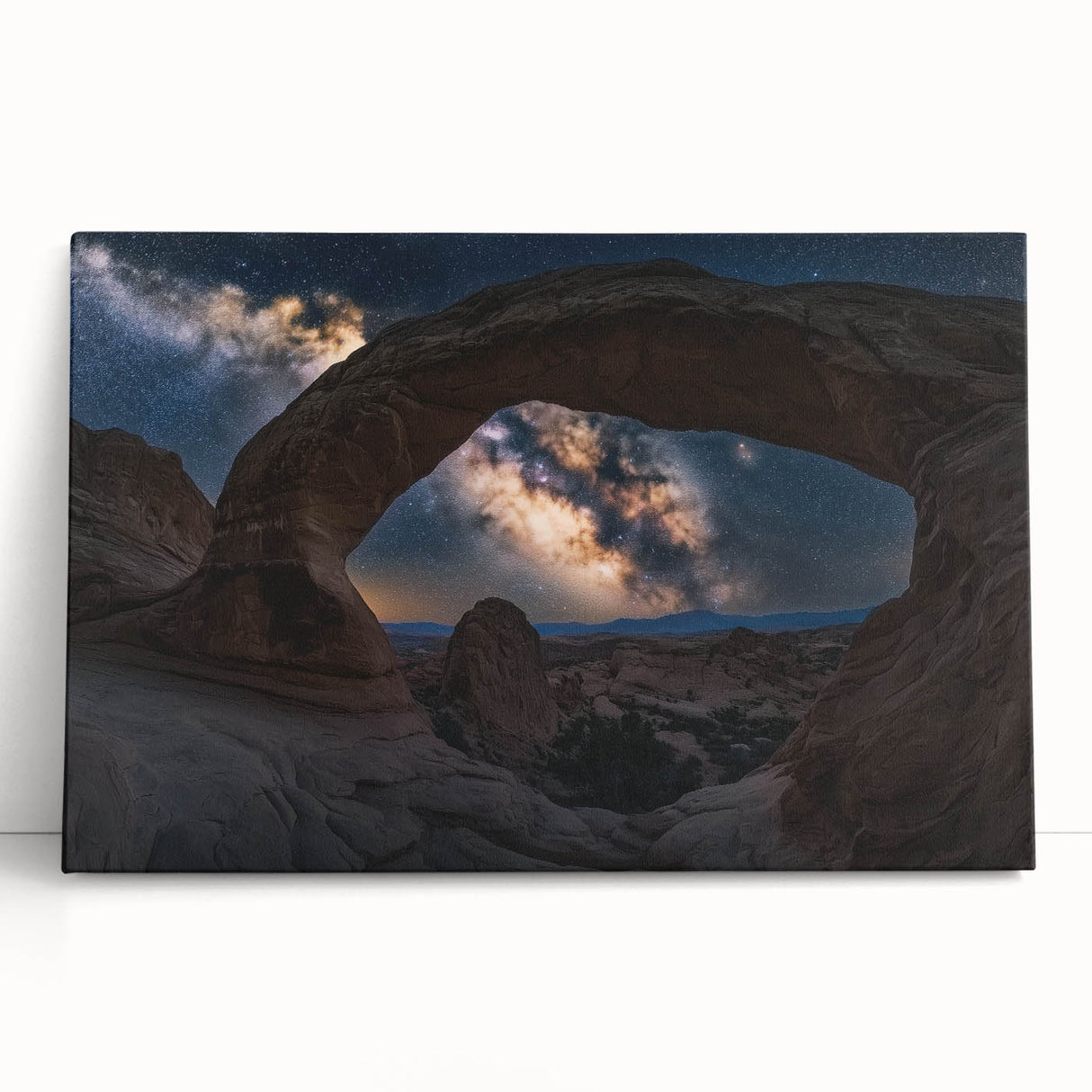Vibrant stretched canvas artwork depicting a stunning desert canyon landscape at sunset, showcasing rich oranges and deep blues, ideal for modern interior decor.