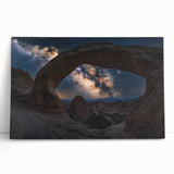 Vibrant stretched canvas artwork depicting a stunning desert canyon landscape at sunset, showcasing rich oranges and deep blues, ideal for modern interior decor.