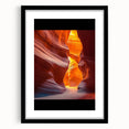 Desert landscape artwork framed in black with a white mat, showcasing vibrant hues of orange and yellow, perfect for modern home decor.
