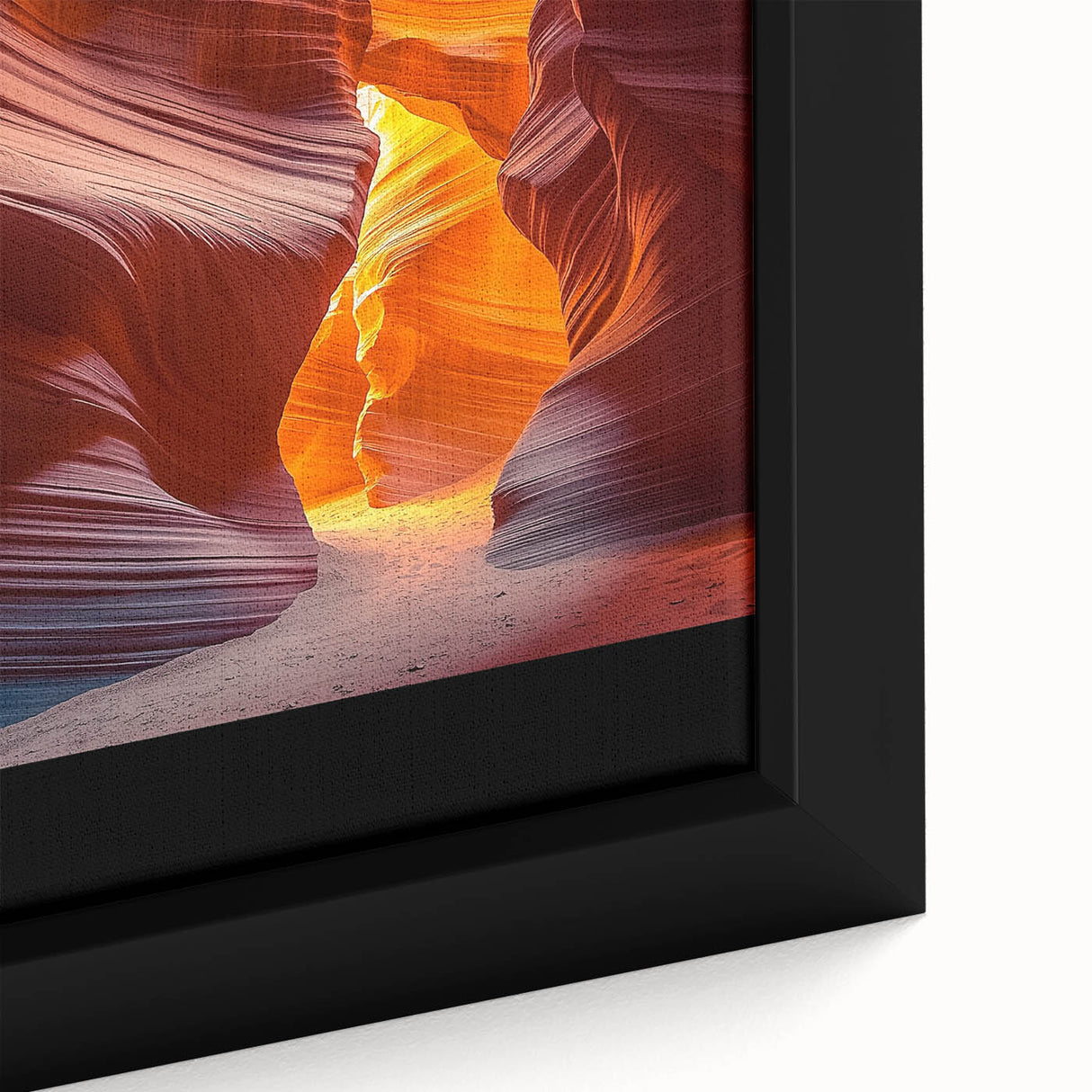Close-up of a framed canvas print depicting a vibrant desert landscape, showcasing warm hues of orange and yellow, with intricate details of sand dunes and cactus plants, perfect for home decor.