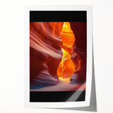 Vibrant rolled print of a desert landscape showcasing warm tones of orange and yellow sand dunes under a clear blue sky, ideal for home decor.
