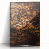 Mid-century modernist art depicting fall foliage in muted earth tones on a silver-framed acrylic print.