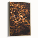 Framed canvas depicting a vintage-style landscape painting with autumnal trees and muted gold and black tones.