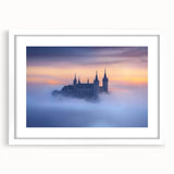 Elegant white-framed landscape artwork featuring a serene castle scene, enhanced with a stylish mat, perfect for home decor or gallery display.