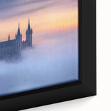 Close-up of a framed canvas artwork depicting a serene landscape with a majestic castle surrounded by lush greenery, designed to enhance home decor.