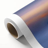 Rolled canvas print showcasing a picturesque landscape featuring a medieval castle surrounded by lush greenery, elegantly packaged in a protective cardboard tube.