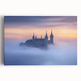 Stretched canvas artwork depicting a vibrant landscape with a majestic castle surrounded by lush greenery and a clear blue sky, perfect for home decor.