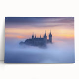 Stretched canvas artwork depicting a stunning landscape with a majestic castle nestled among vibrant greenery and a serene sky, ideal for home decor.