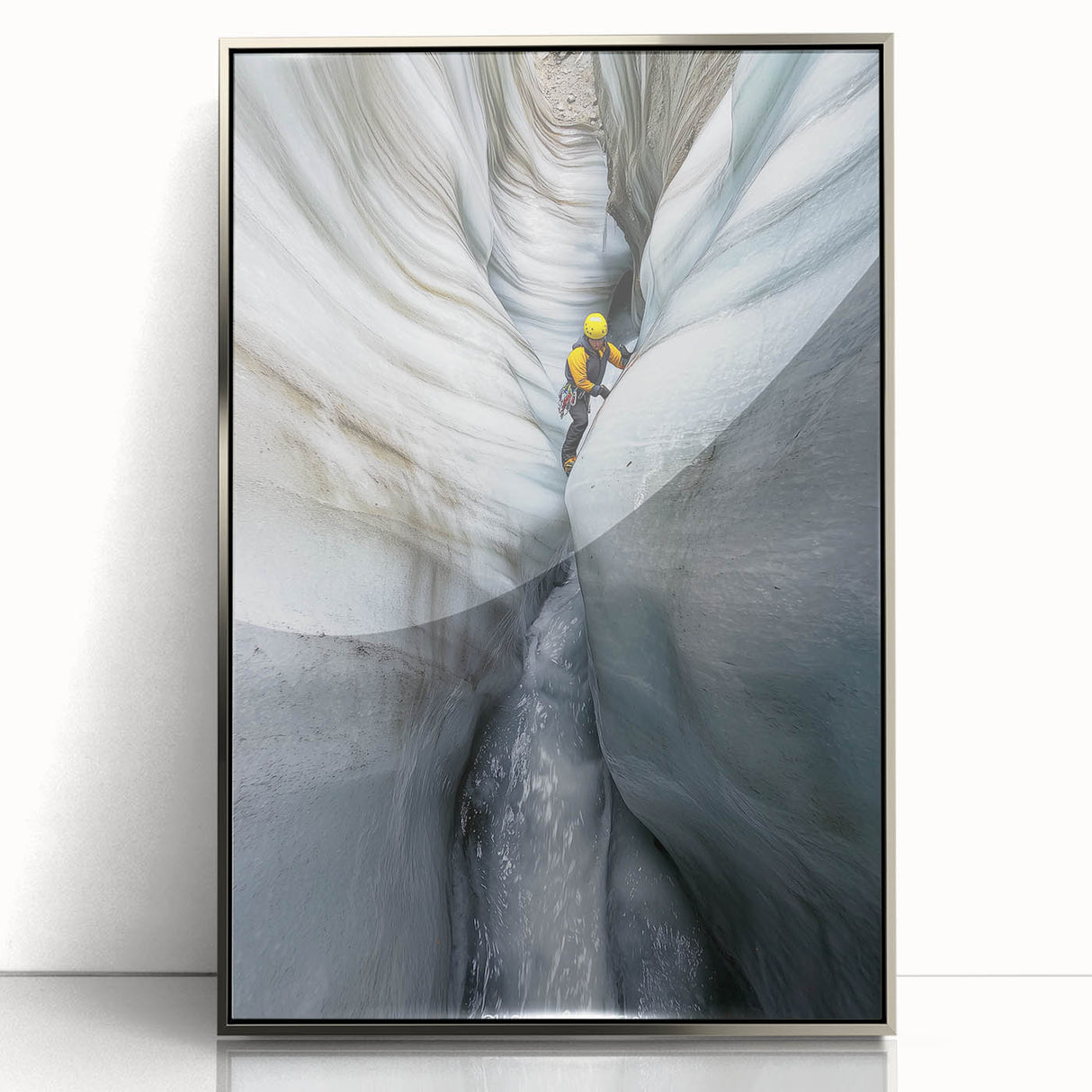 Framed acrylic artwork depicting a serene landscape with caves, featuring a sleek silver frame that enhances the modern decor aesthetic. Ideal for home or office display.