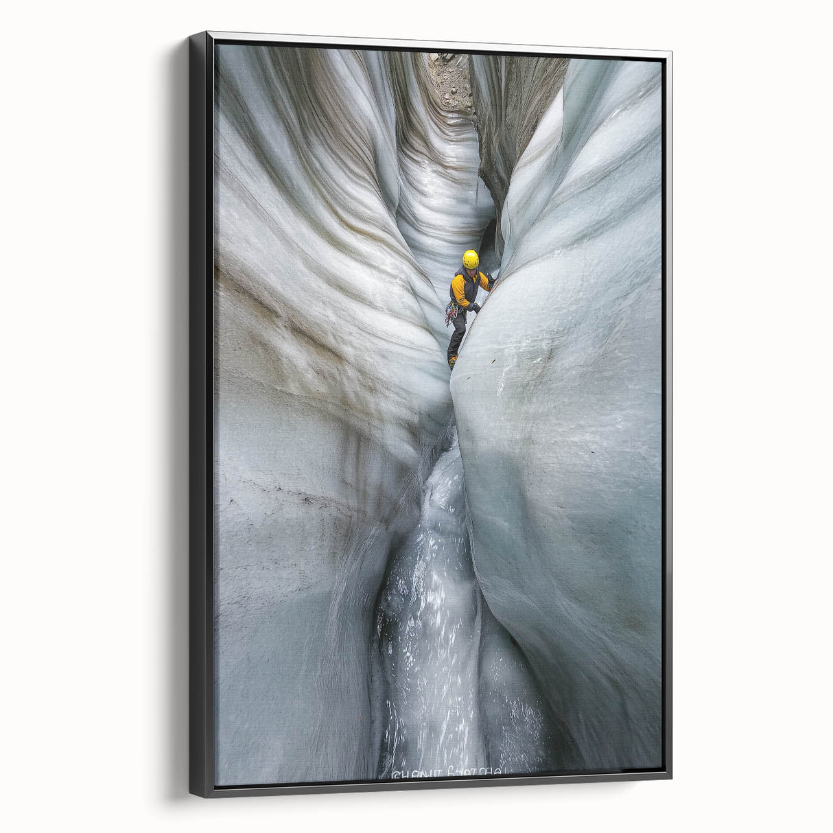 Framed canvas artwork showcasing a stunning landscape of caves, featuring rich colors and intricate details, set in a sleek black frame for modern decor.