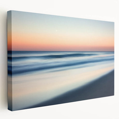 Stretched canvas artwork depicting a serene beach landscape with vibrant sunset colors, showcasing gentle waves and palm trees, perfect for coastal home decor.