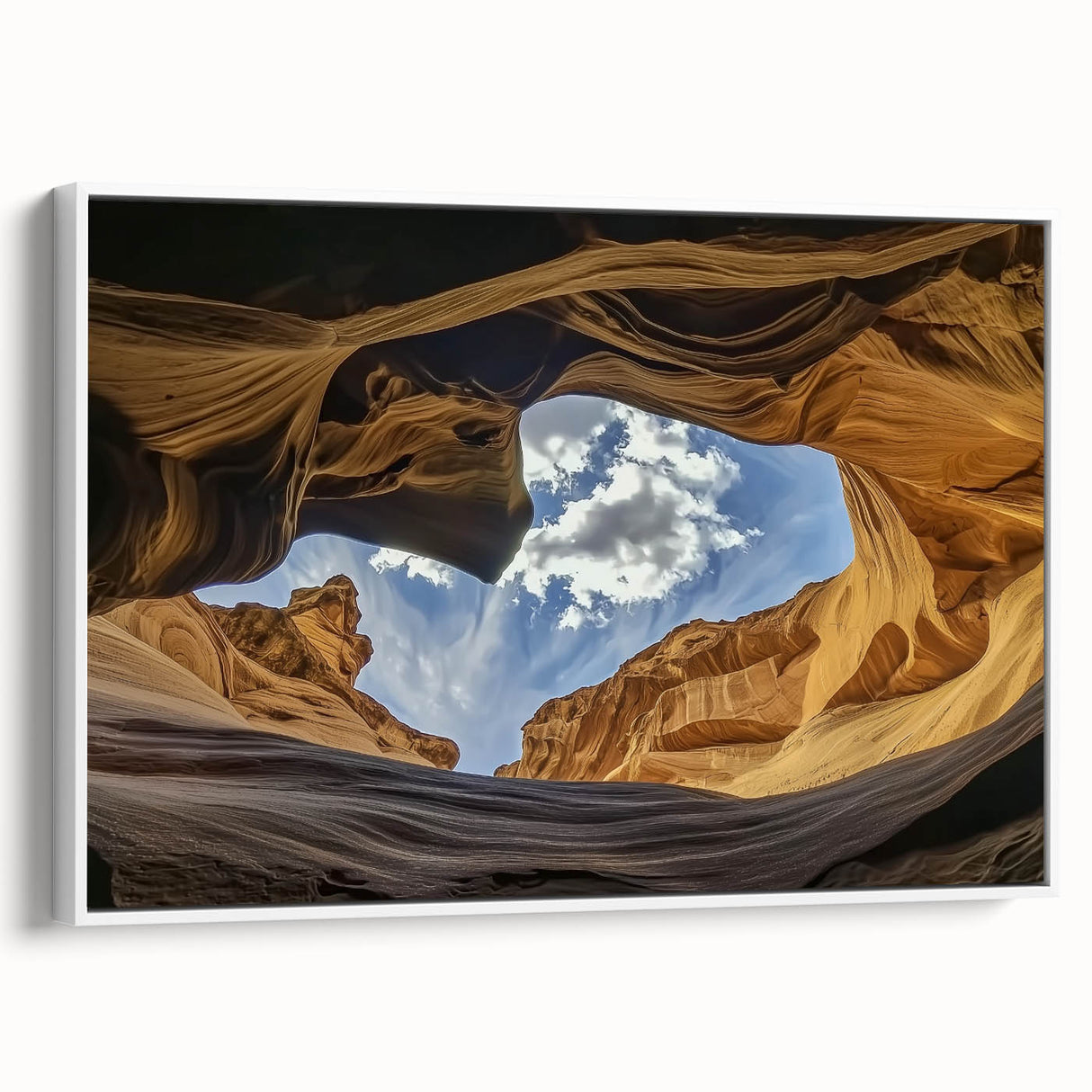 Framed landscape canvas showcasing vibrant canyons in earthy tones, featuring a white frame that enhances the artwork's depth and detail, ideal for home decor.