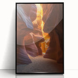 Framed acrylic artwork depicting a vibrant desert landscape, featuring warm hues of orange and yellow with striking black framing, perfect for modern home decor.