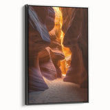 Framed canvas artwork depicting a vibrant desert landscape with rich colors, featuring a black frame and side view showcasing its artistic depth and detail.