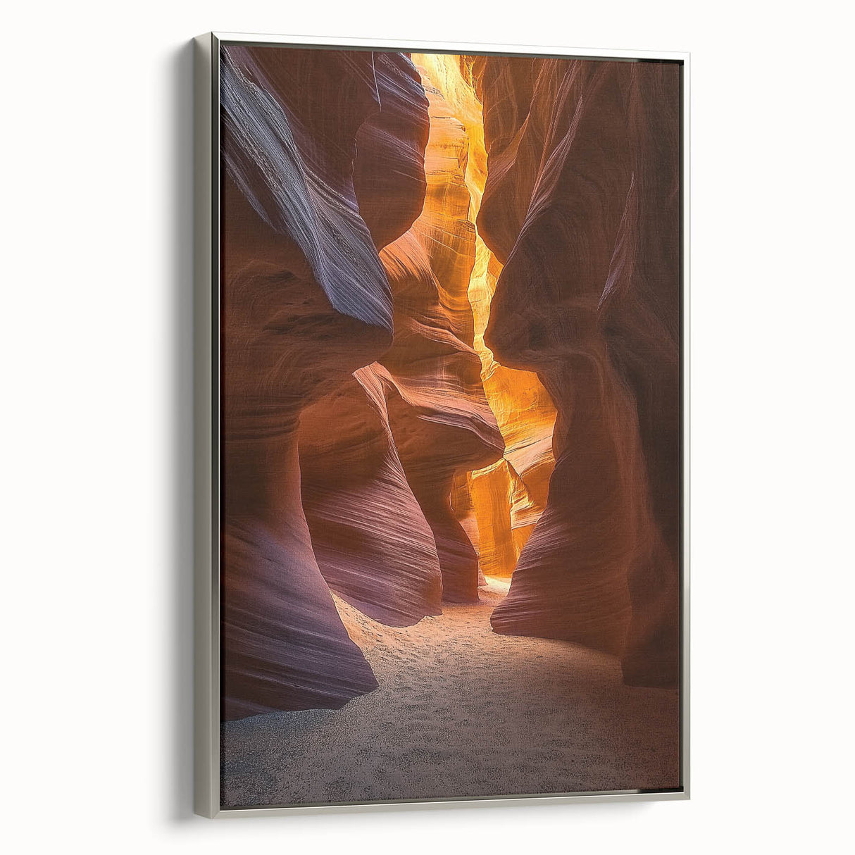 Framed canvas artwork depicting a vibrant desert landscape with warm hues of orange and yellow, accented by a sleek silver frame, ideal for modern decor.