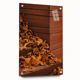 Large abstract wall art featuring swirling orange and brown hues on acrylic glass, suitable for bedroom or dining room decor.