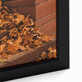 Close-up of extra large framed canvas featuring textured black wall art with colorful autumn-themed accents.