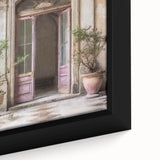 Close-up of a large framed canvas featuring a textured image of a black French door surrounded by colorful, abstract designs.