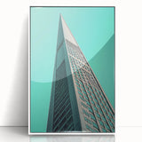 Art deco poster featuring geometric shapes in black and gold on a white acrylic framed print.