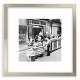 Textured abstract art print in silver frame, featuring indistinct shapes in neutral tones, ideal for bedroom wall decor.