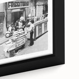 Close-up of a framed canvas featuring black wall art with colorful, textured depictions of people dining.