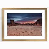 Textured abstract art print of Algerian scenery in muted earth tones, framed in gold, ideal for bedroom art.