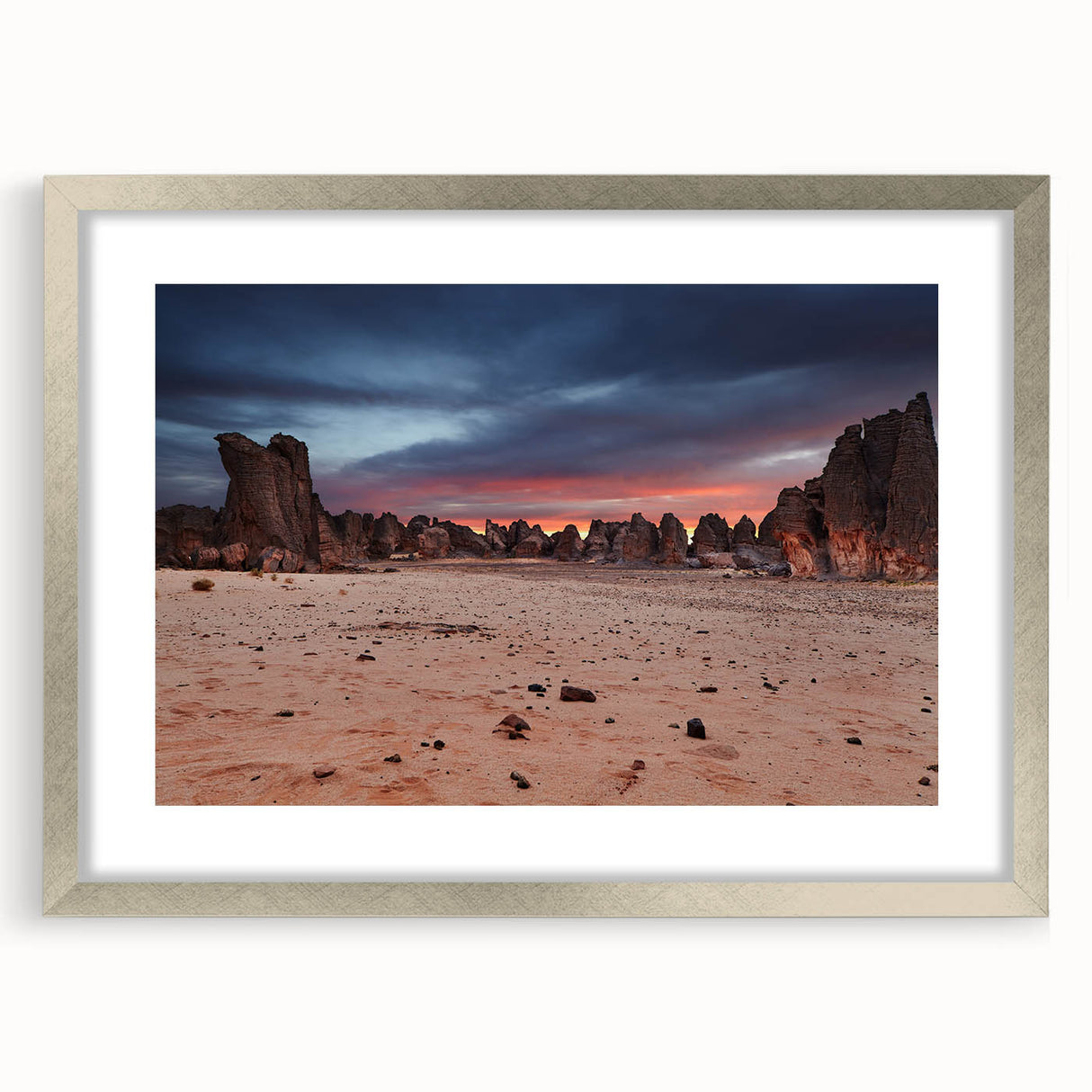 Abstract art print depicting an Algerian landscape in muted earth tones, framed with a silver mat.