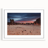 Extra large abstract art print featuring textured scenery of Algeria in muted earth tones, framed with a white mat.