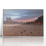 Large art print of an Algerian landscape in mid-century modernist style, with muted earth tones, framed in white acrylic.