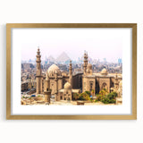 Textured art depicting an abstract Egyptian landscape in gold and earth tones on a framed canvas, suitable for bedroom decor.