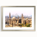 Abstract art print of Egyptian scenery in muted earth tones on a framed silver mat.