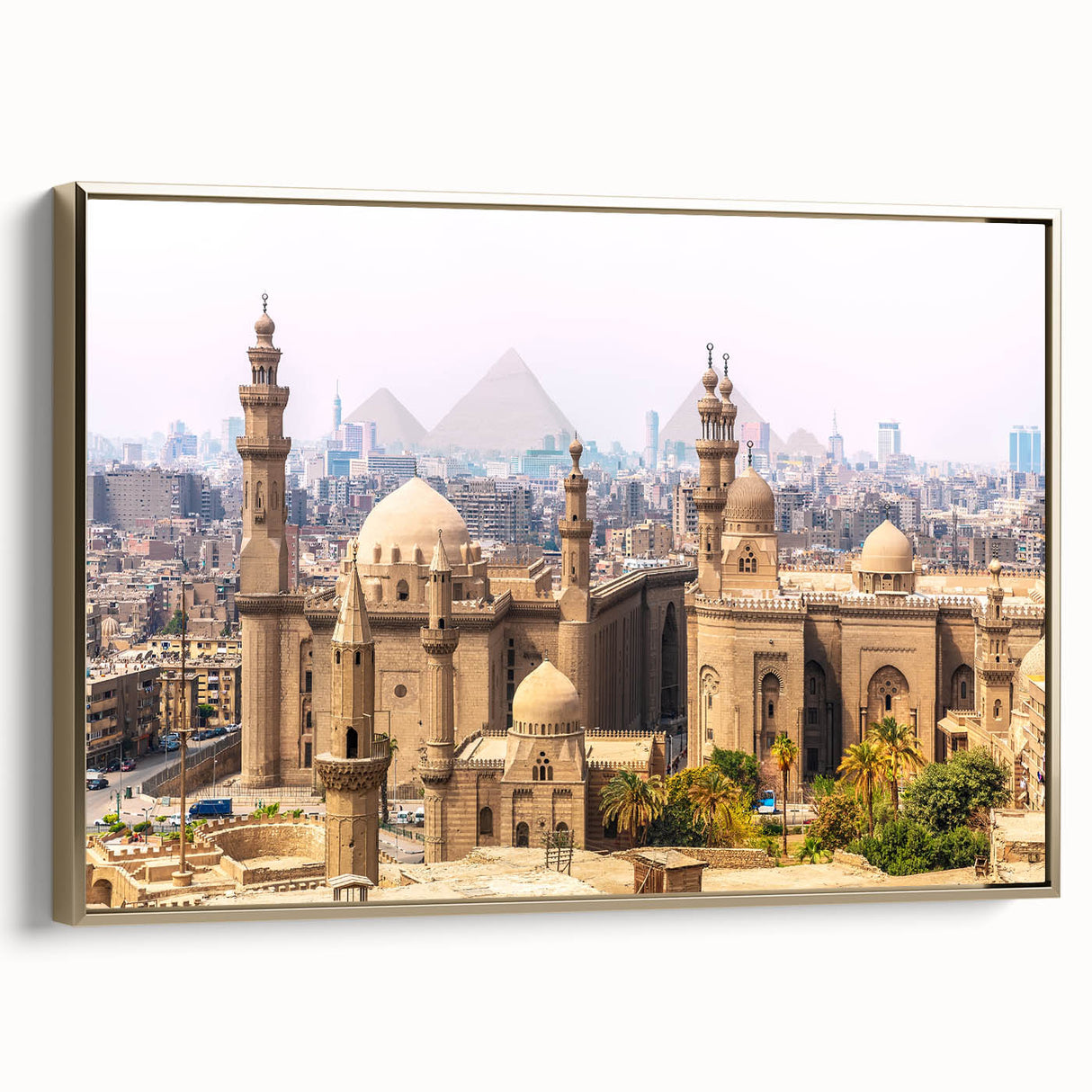 Framed canvas depicting a vintage-style landscape of Egypt with pyramids in muted gold and black tones.