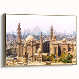 Framed canvas depicting a vintage-style landscape of Egypt with pyramids in muted gold and black tones.